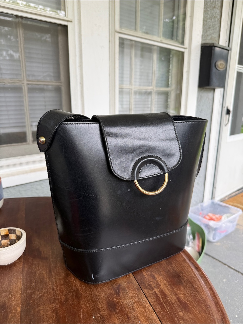 Women's Black Leather Shoulder Bag with Gold Ring Accent
